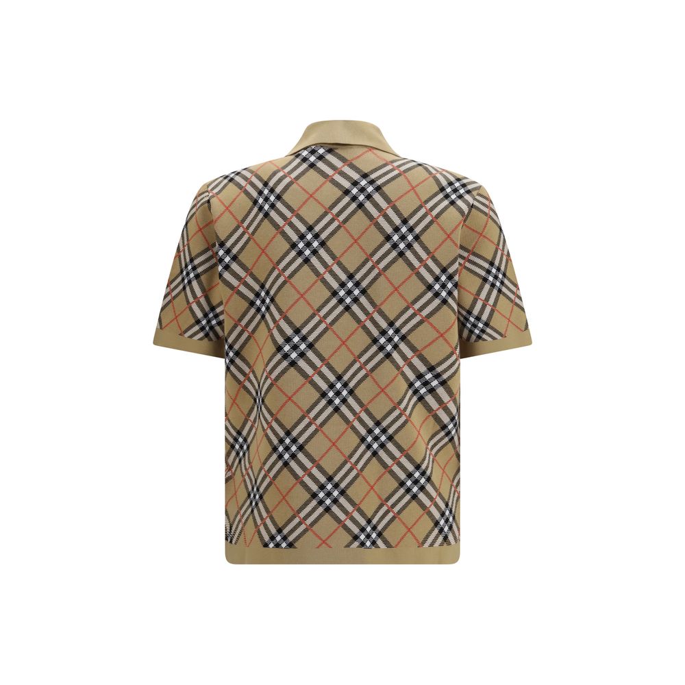 Elevate your style with the Burberry Beige Cotton Polo Shirt, a luxurious blend of Italian craftsmanship and timeless elegance, perfect for any distinguished occasion.