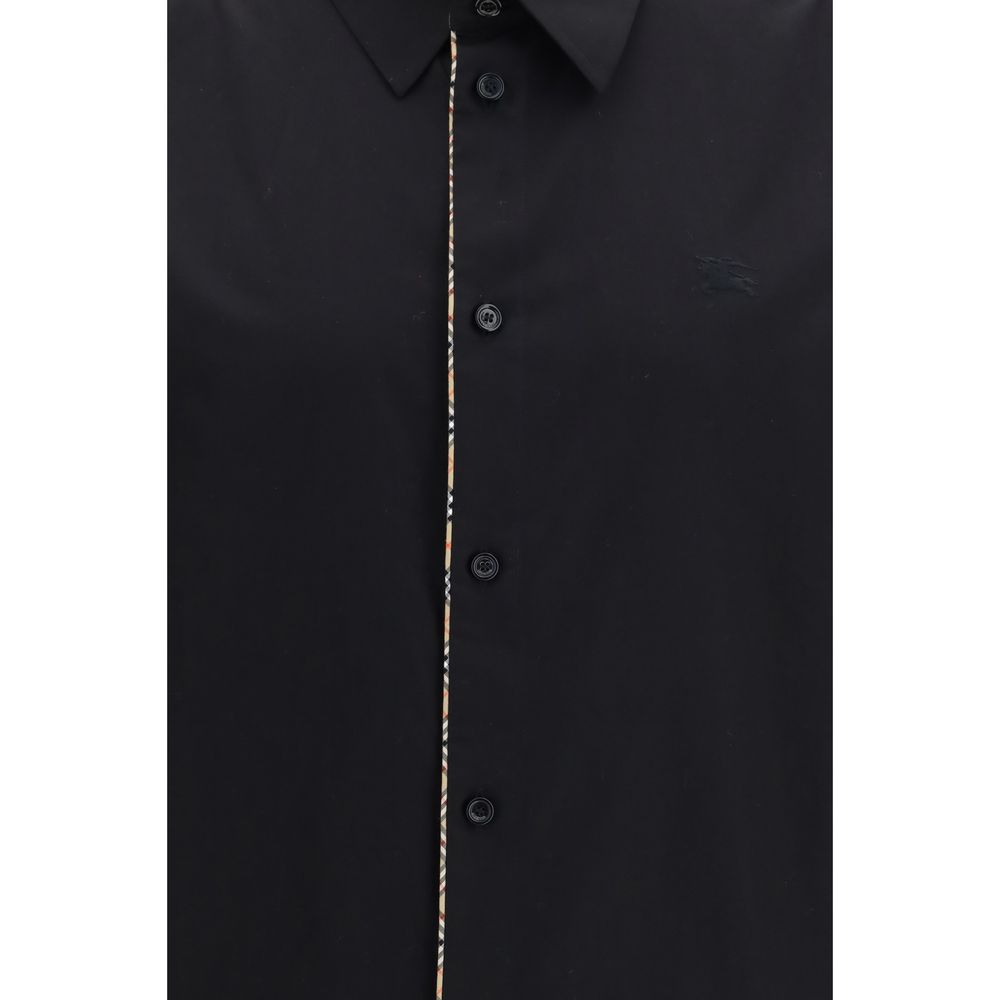 Indulge in the Burberry Black Cotton Dress Shirt, a masterpiece of cotton poplin that redefines elegance, perfect for those who appreciate timeless luxury and sophistication.