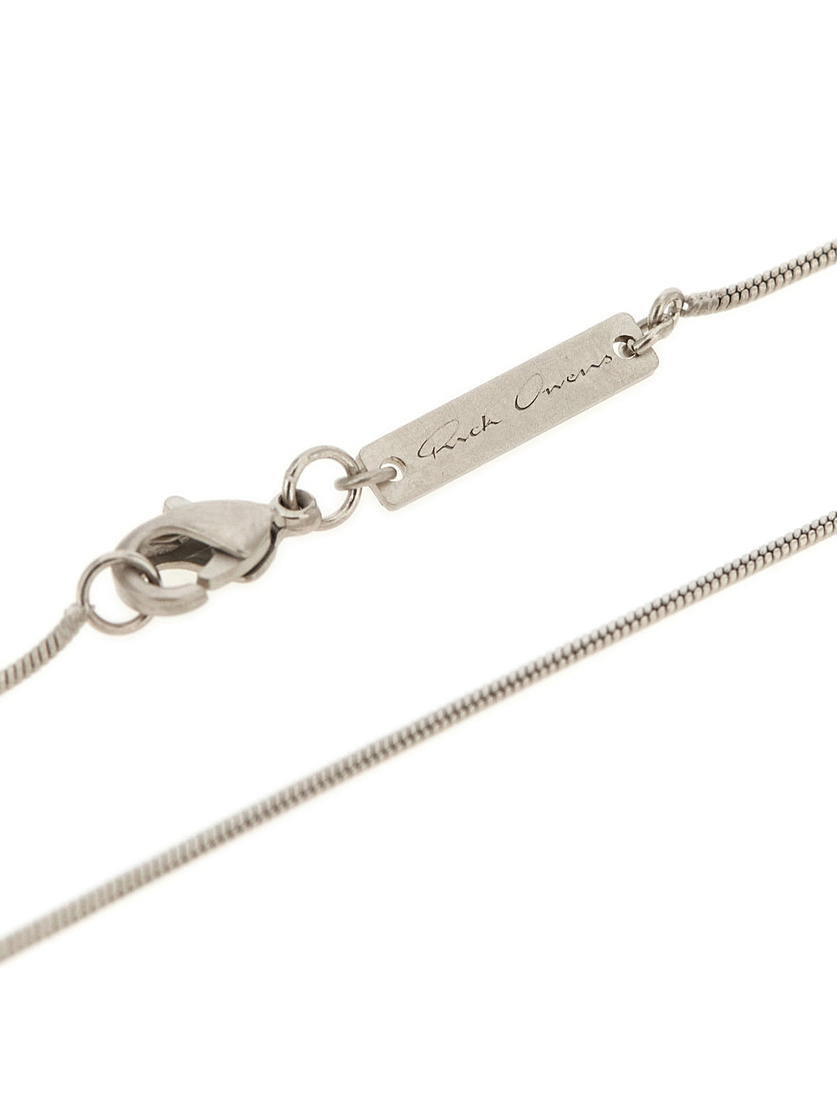 Elevate your style with the Rick Owens Silver Brass Necklace, a stunning blend of palladium-galvanized brass and a crystal pendant, crafted in Italy for the discerning individual.