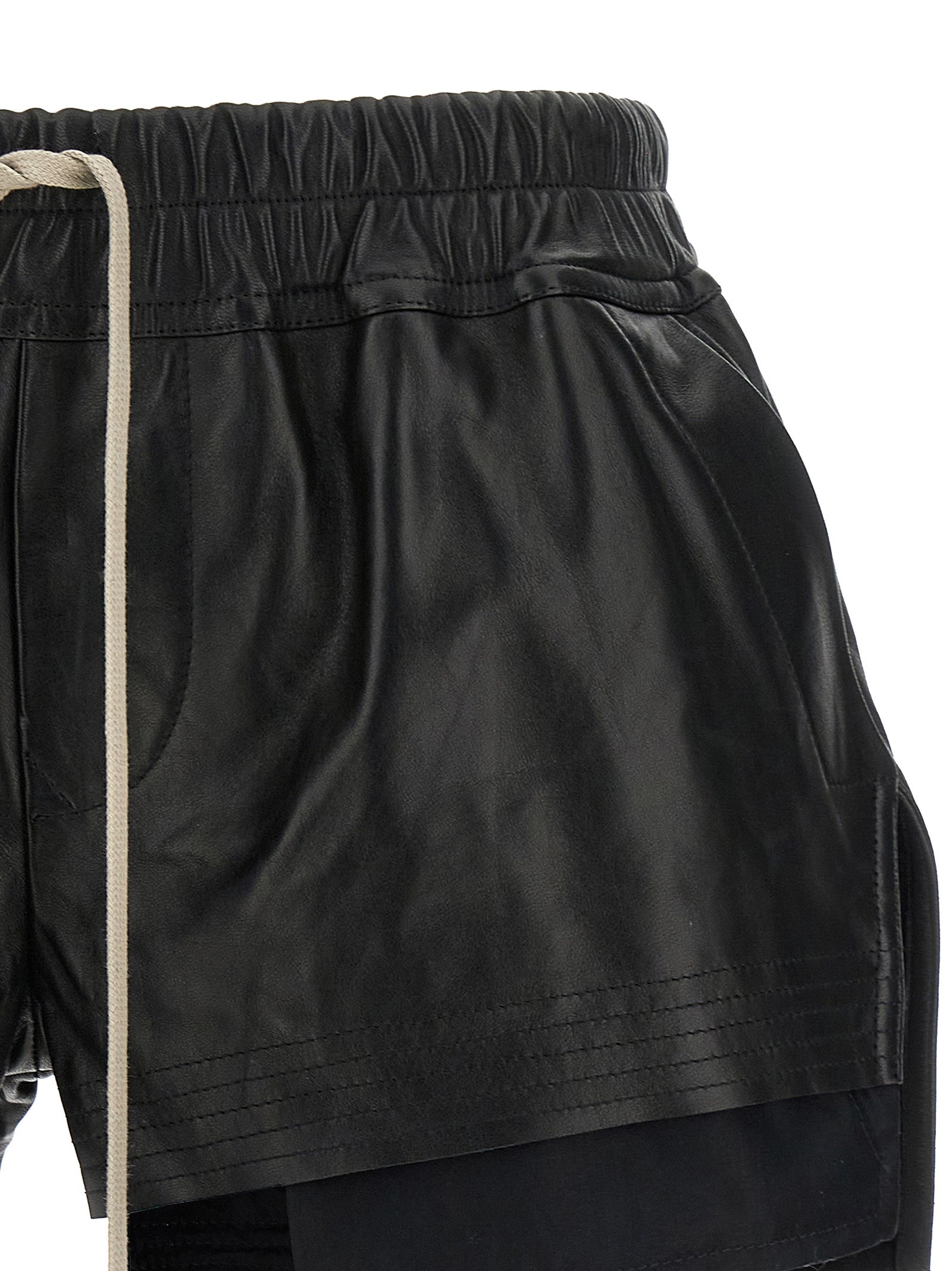 Indulge in the exquisite Rick Owens Black Lamb Leather Bermuda Shorts from the Fog Collection, where luxurious craftsmanship meets avant-garde design for a statement of elegance.