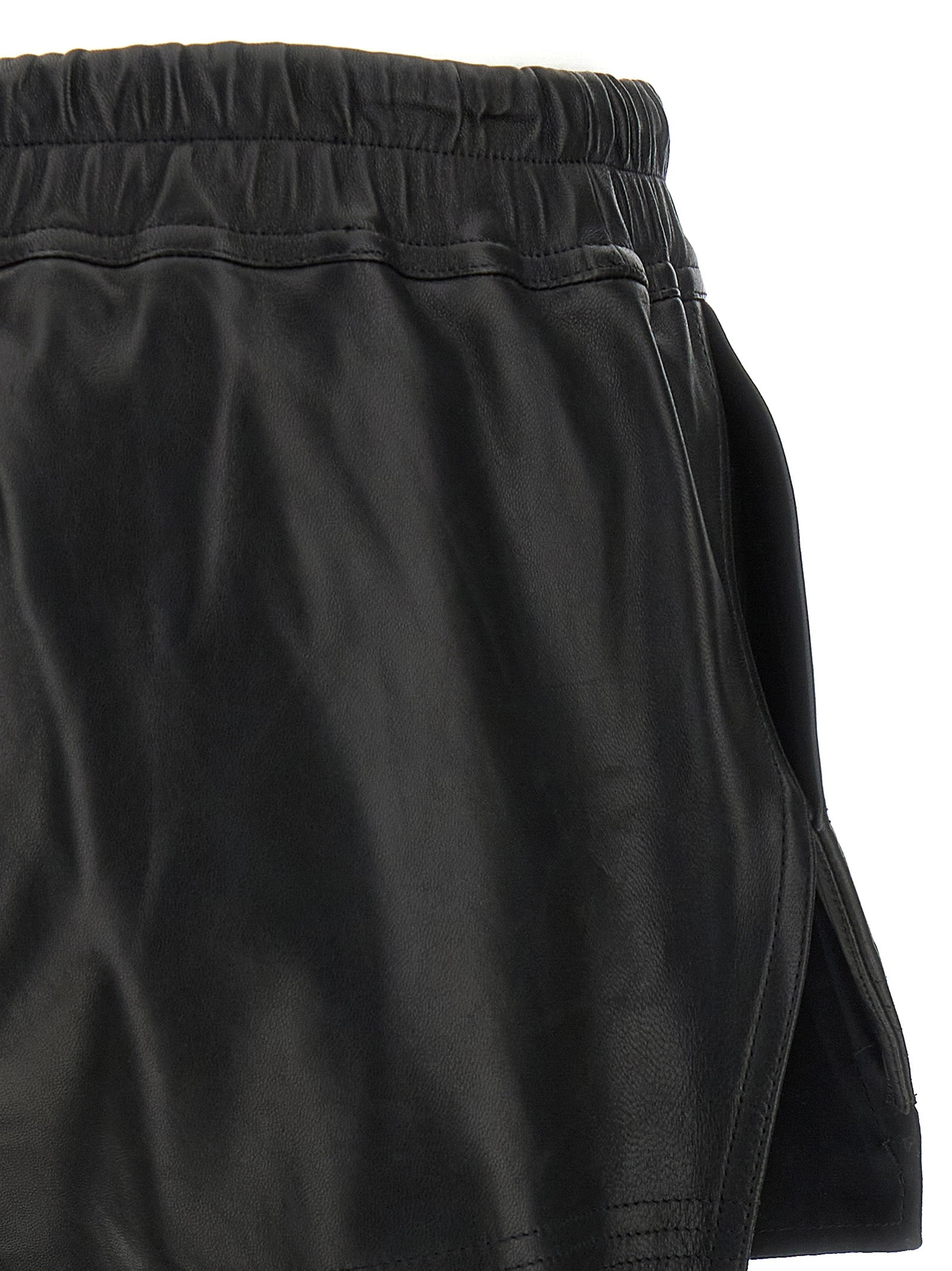 Elevate your wardrobe with Rick Owens Black Lamb Leather Bermuda Shorts, a masterpiece of luxury craftsmanship and avant-garde design, perfect for the discerning fashionista.