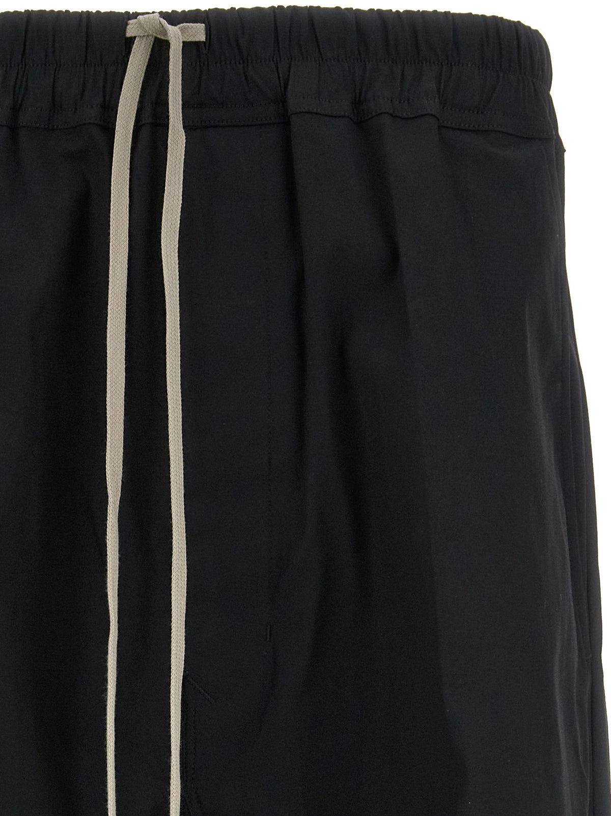 Elevate your wardrobe with Rick Owens Black Cotton Casual Pants, a fusion of avant-garde design and tailored comfort, crafted for the discerning fashion connoisseur.