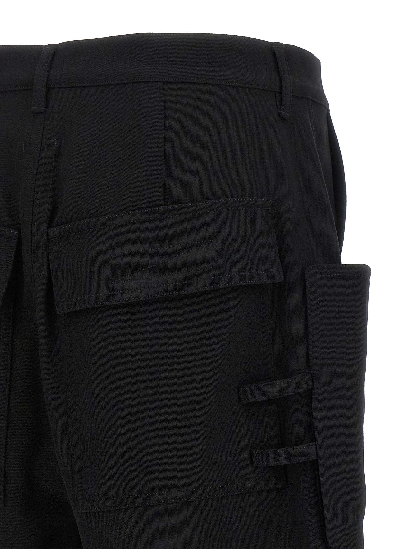 Elevate your wardrobe with Rick Owens' Black Wool Bermuda Shorts, where avant-garde design meets luxurious craftsmanship, perfect for the discerning individual.