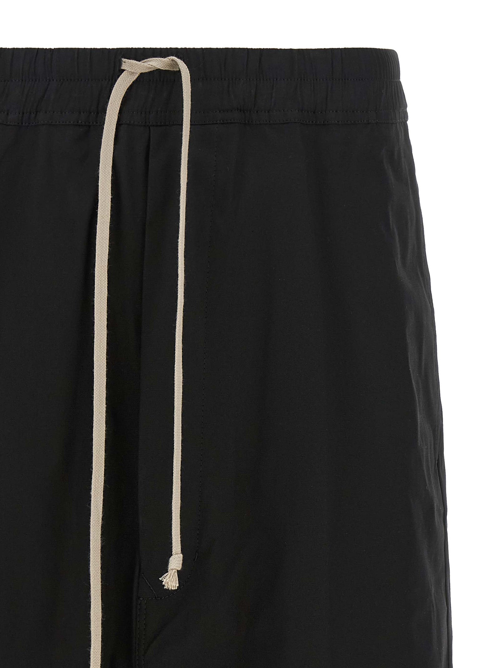 Experience the bold sophistication of Rick Owens Black Cotton Bermuda Shorts, crafted from premium cotton poplin for effortless elegance in every urban adventure.