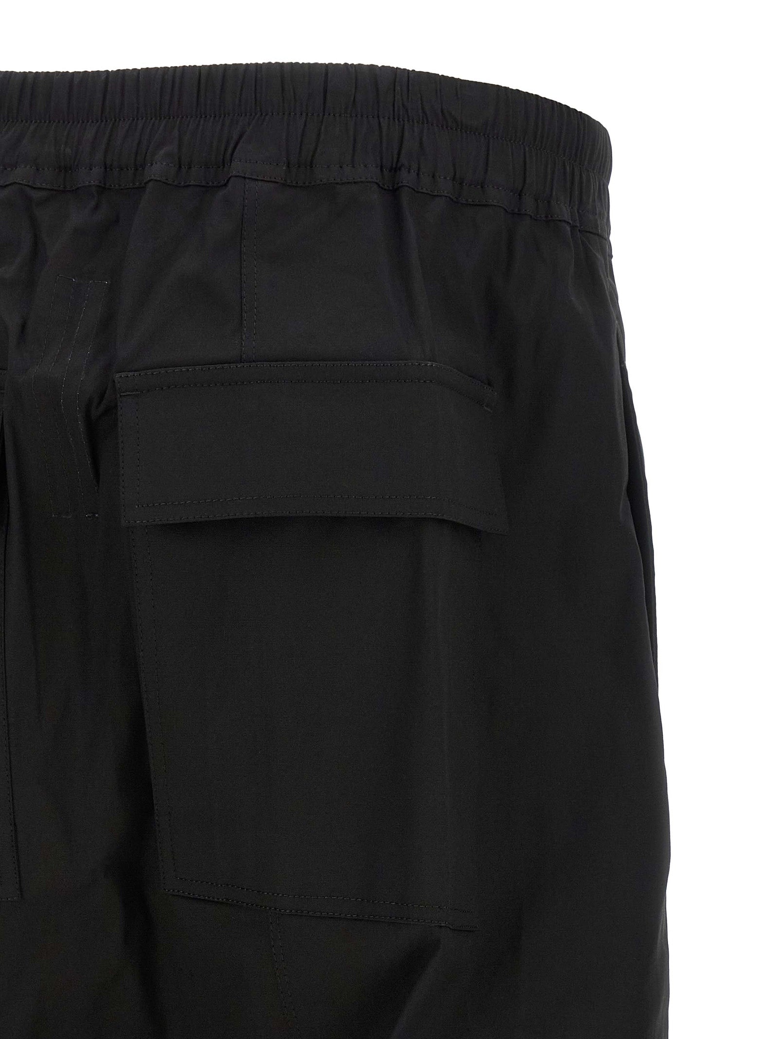 Experience the bold sophistication of Rick Owens Black Cotton Bermuda Shorts, crafted from luxurious cotton poplin for effortless elegance and contemporary style.