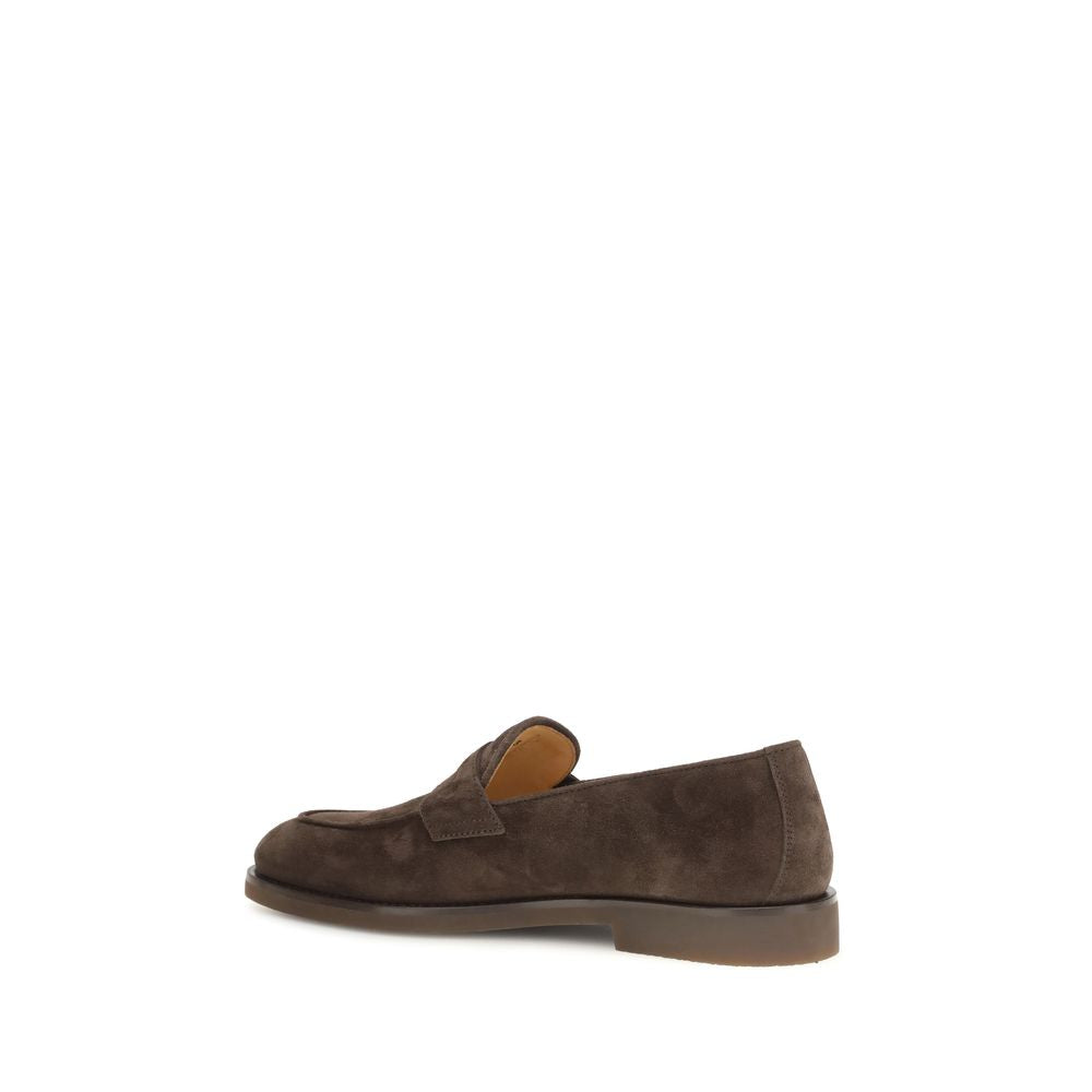 Elevate your style with Brunello Cucinelli's Brown Calf Leather Bos Taurus Slip-On Loafers, where exquisite craftsmanship meets timeless elegance for the discerning individual.