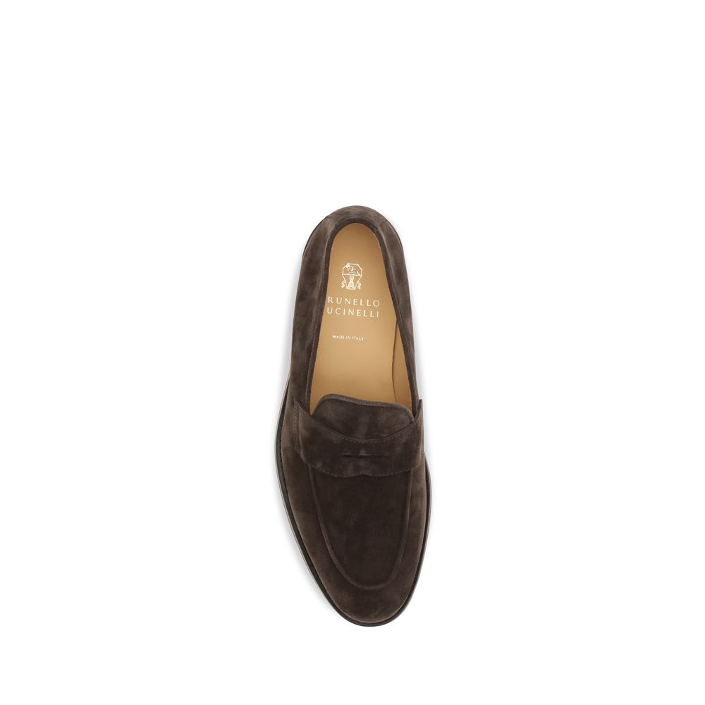 Indulge in the timeless elegance of Brunello Cucinelli's Brown Calf Leather Bos Taurus Slip-On Loafers, crafted for those who appreciate refined luxury and effortless style.
