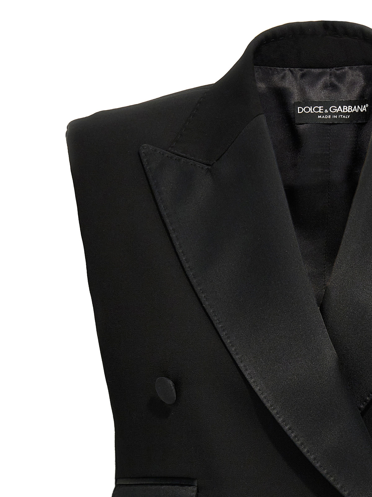 Elevate your elegance with the Dolce & Gabbana Black Silk Sleeveless Jacket, a masterpiece of Italian craftsmanship that embodies sophistication and modern allure.