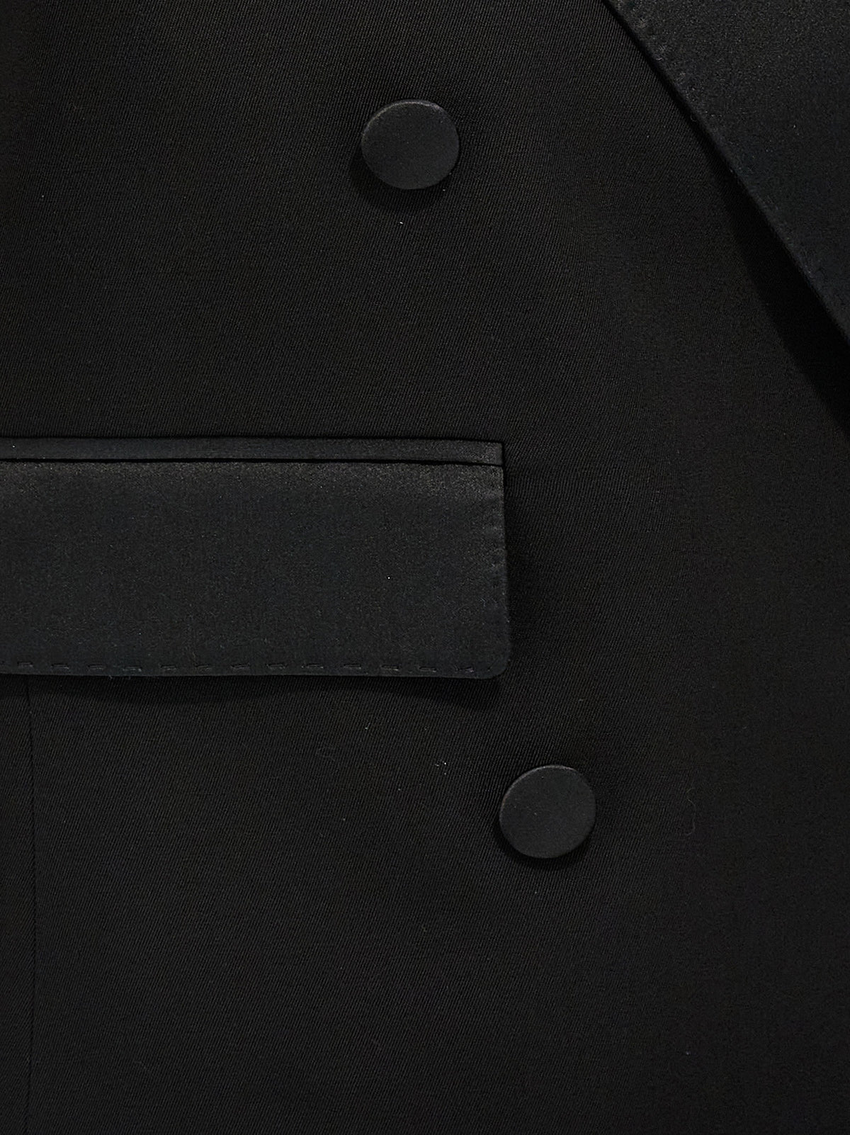 Elevate your wardrobe with the Dolce & Gabbana Black Silk Sleeveless Jacket, a masterpiece of Italian craftsmanship blending silk and virgin wool for timeless sophistication.