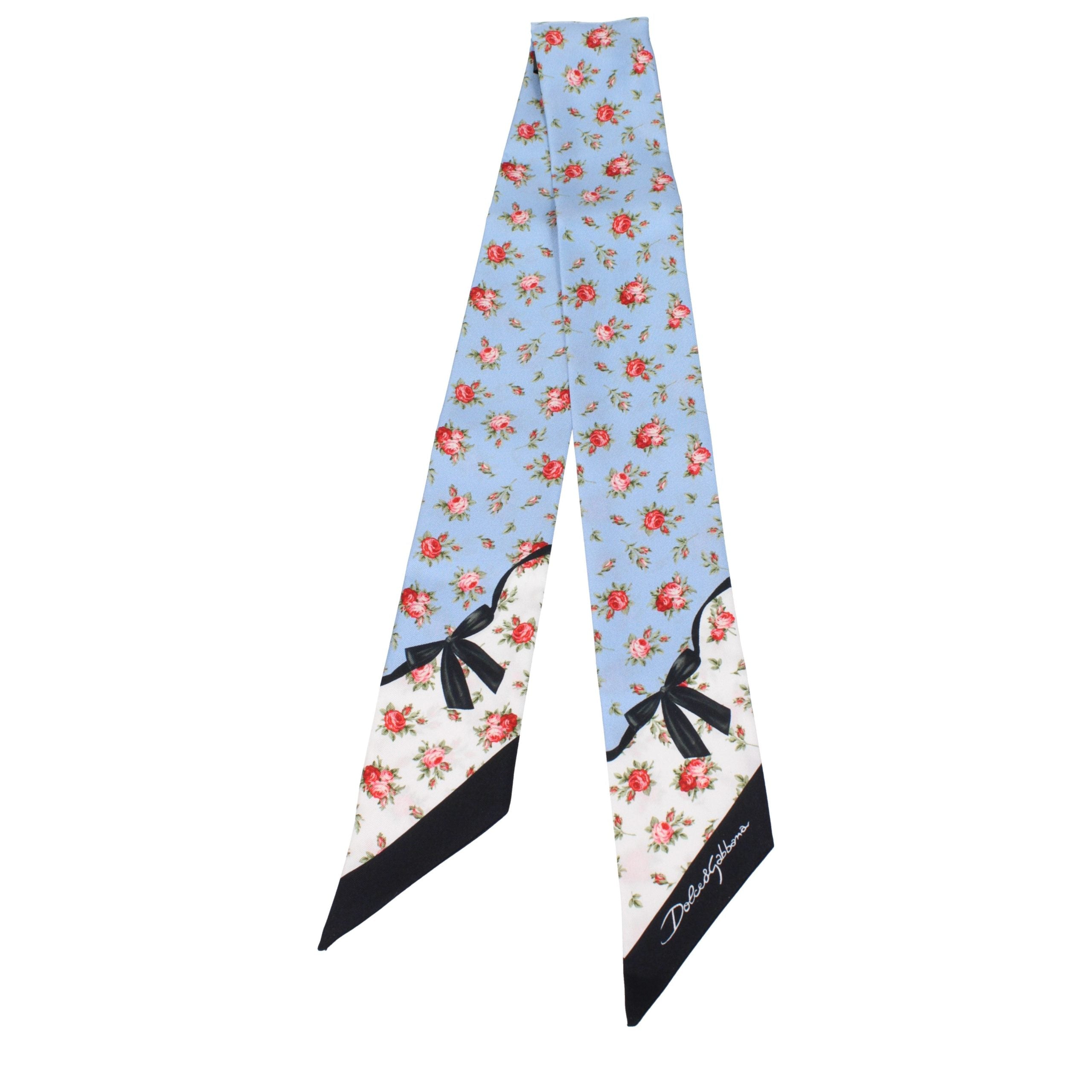 Indulge in the exquisite Dolce & Gabbana Light Blue Silk Foulard, a floral masterpiece that embodies elegance and sophistication, perfect for the discerning individual.