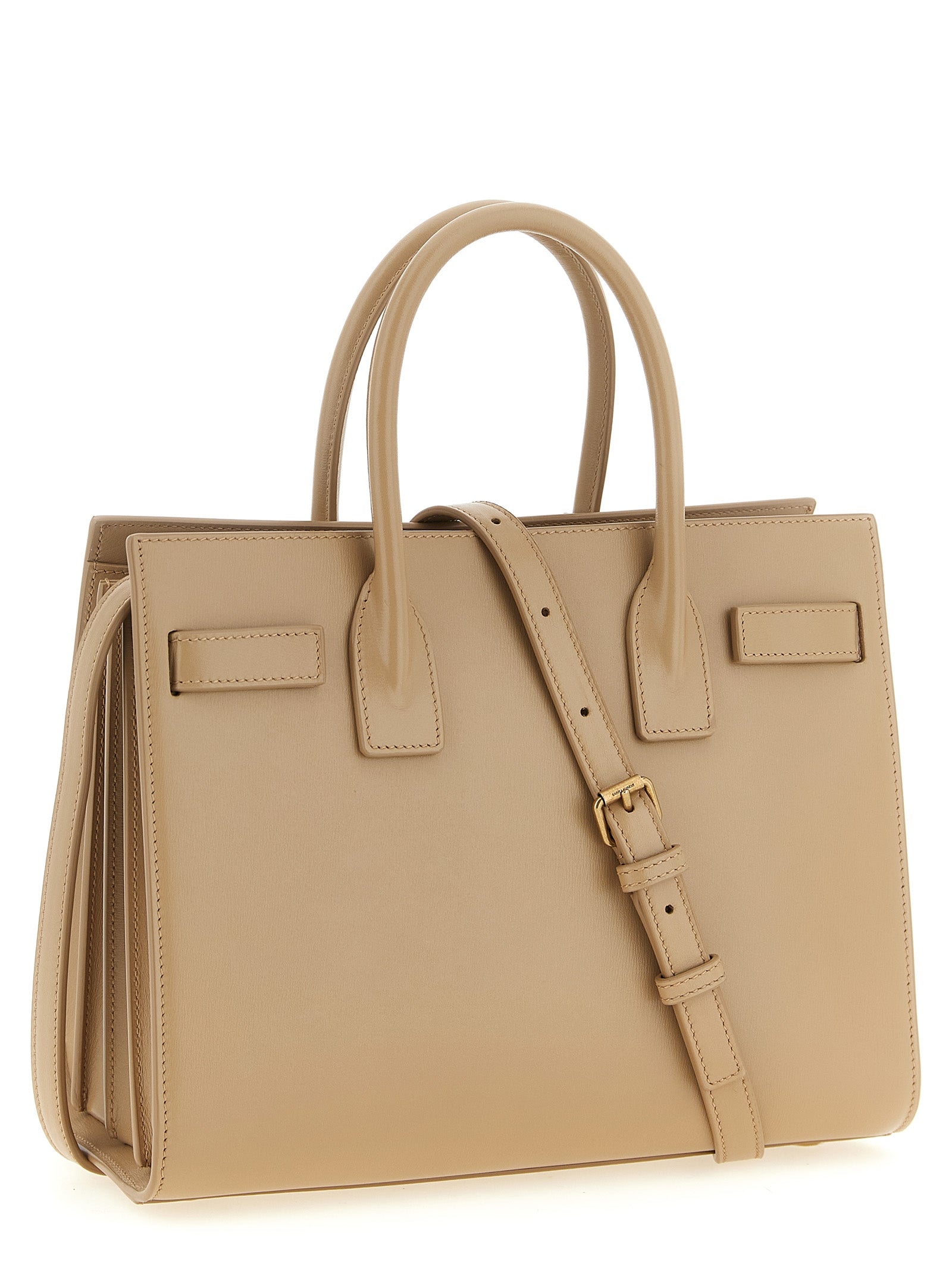 Discover the exquisite Saint Laurent Beige Calfskin Handbag, a masterpiece of Italian craftsmanship, blending luxury and functionality for the discerning individual.