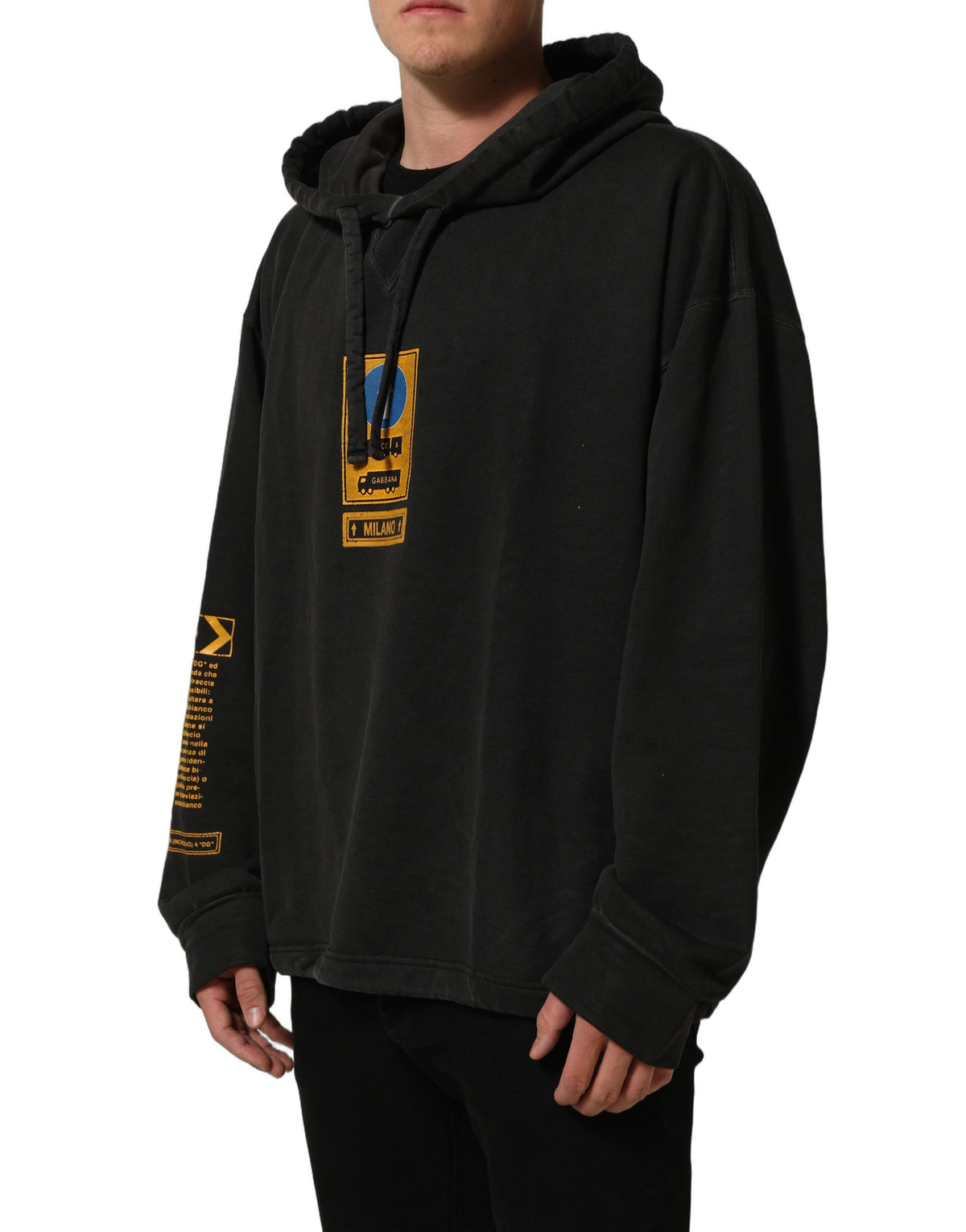 Elevate your wardrobe with the Dolce & Gabbana Black Cotton Logo Hooded Oversize Sweater, a luxurious statement piece crafted from premium cotton, embodying sophistication and timeless elegance.
