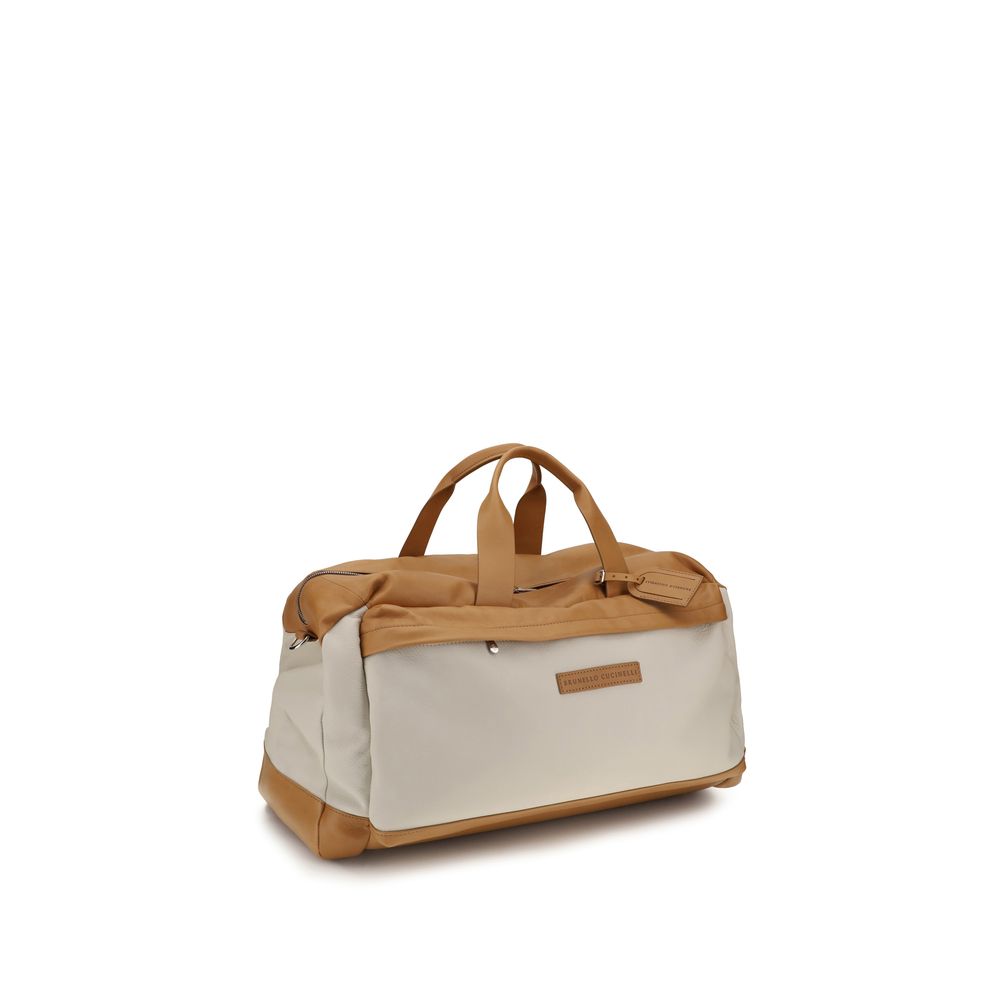 Elevate your travel experience with the Brunello Cucinelli Beige Calf Leather Active Travel Bag, a masterpiece of craftsmanship that embodies timeless sophistication and refined elegance.