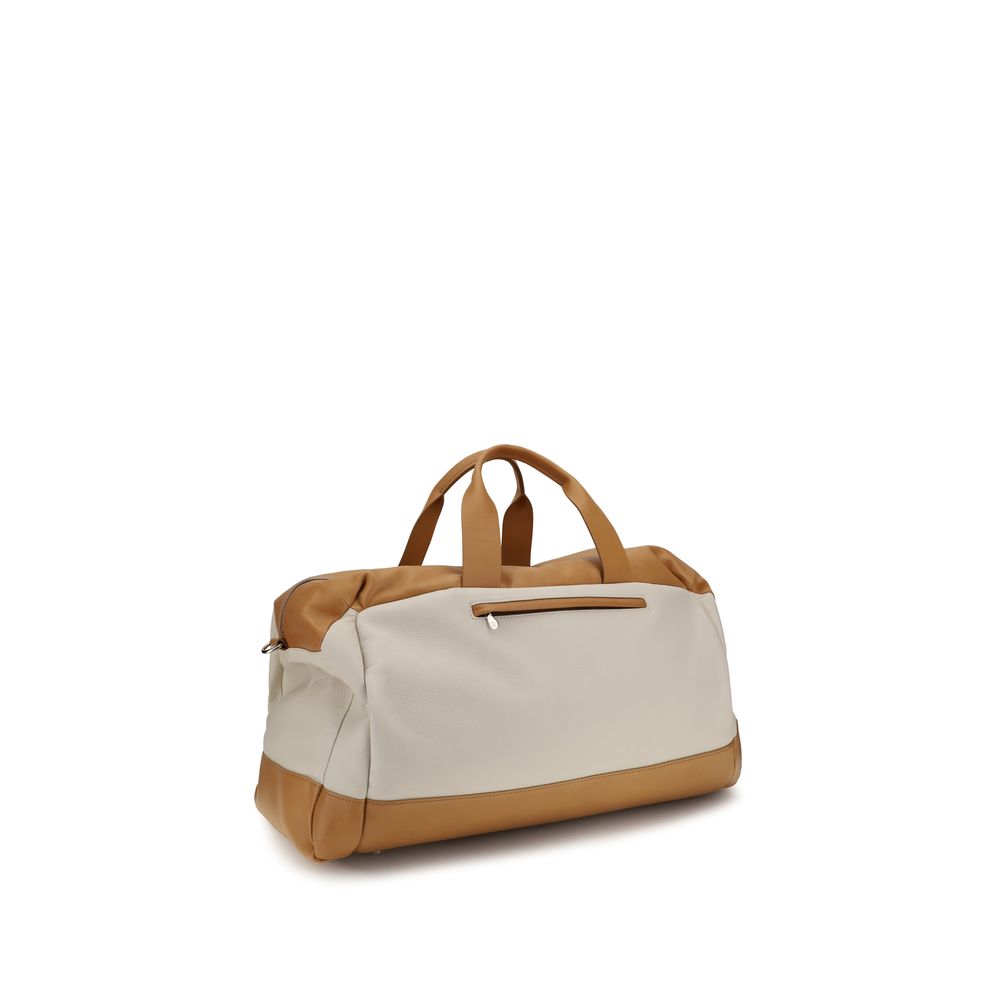 Elevate your travel experience with the Brunello Cucinelli Beige Calf Leather Active Travel Bag, a masterpiece of sophistication and practicality for the discerning traveler.