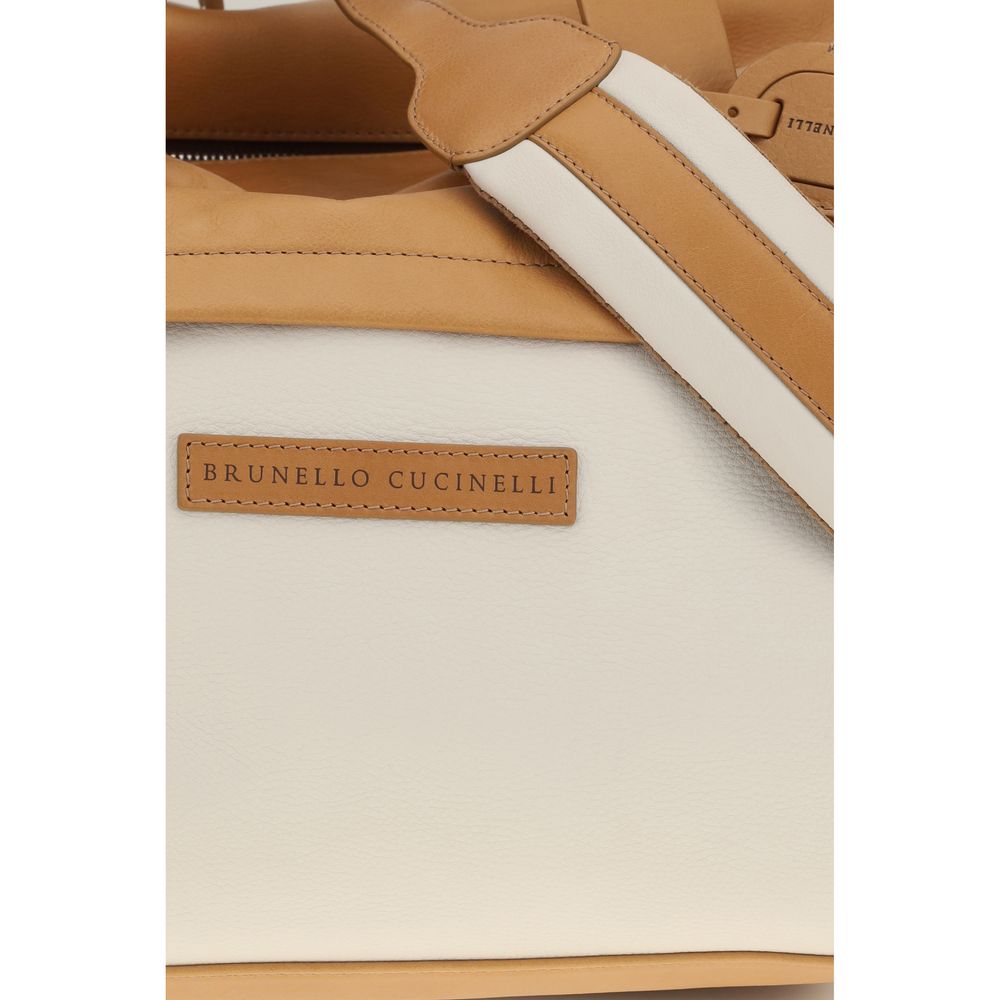 Discover the Brunello Cucinelli Beige Calf Leather Travel Bag, a masterpiece of craftsmanship and elegance, perfect for the discerning traveler seeking sophistication.