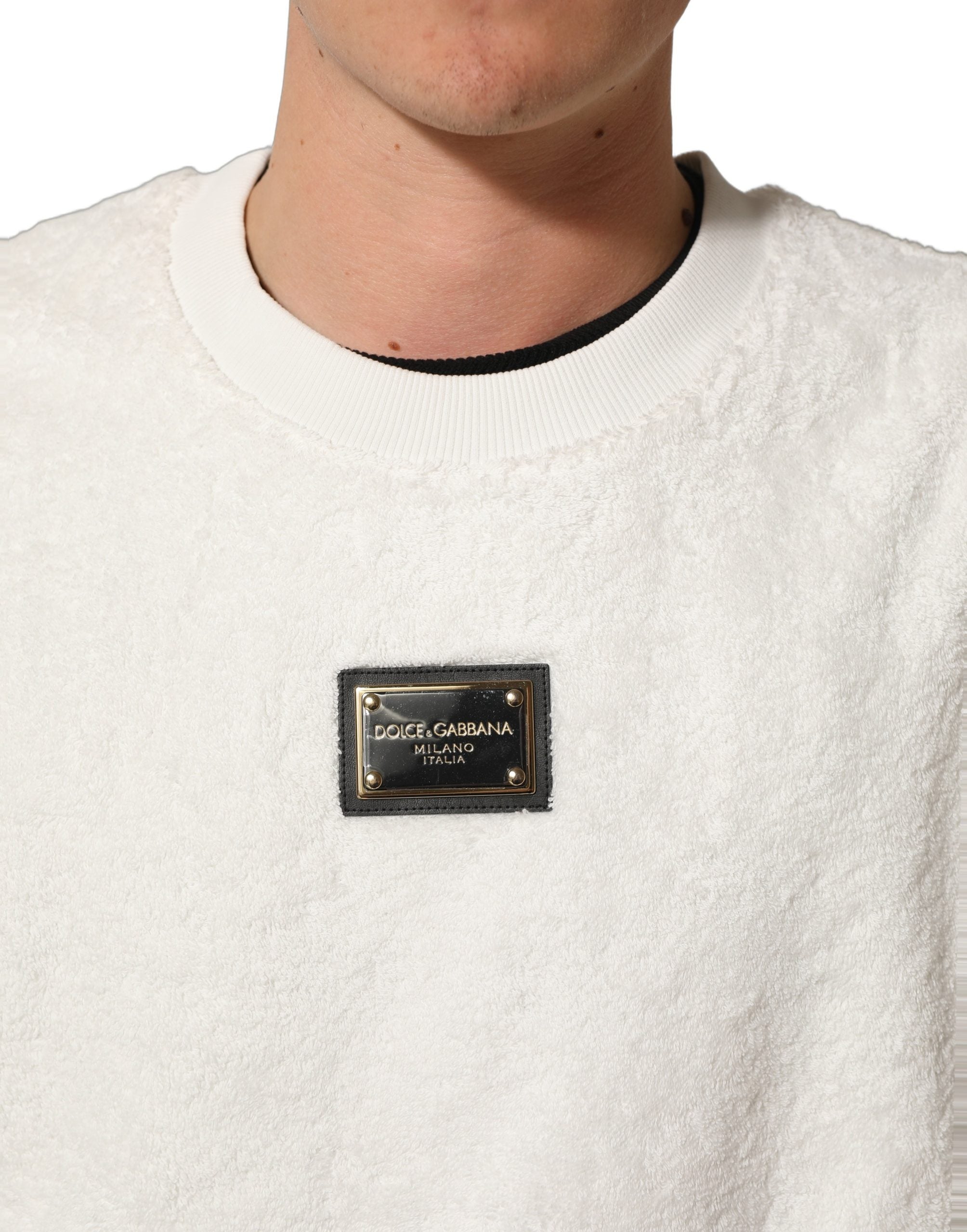 Elevate your wardrobe with the Dolce & Gabbana White LogoPlaque CrewNeck Sweatshirt, a masterpiece of Italian craftsmanship in luxurious cotton, embodying sophistication and style.
