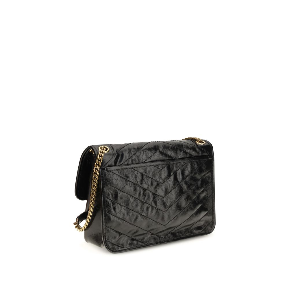 Discover the Saint Laurent Black Calf Leather Bos Taurus Shoulder Bag, a timeless masterpiece of exquisite craftsmanship and sophisticated design, perfect for elevating any ensemble.
