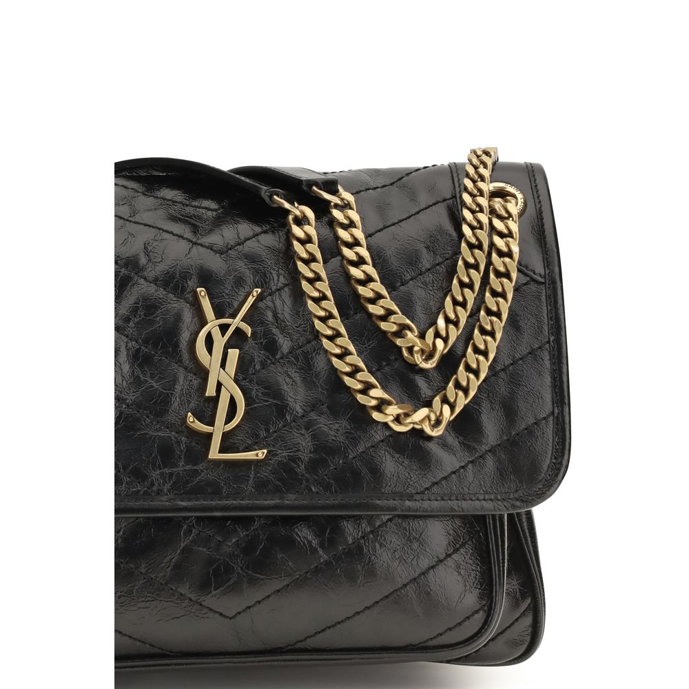 Discover the Saint Laurent Black Calf Leather Bos Taurus Shoulder Bag, a fusion of exquisite craftsmanship and timeless elegance, perfect for the discerning individual.