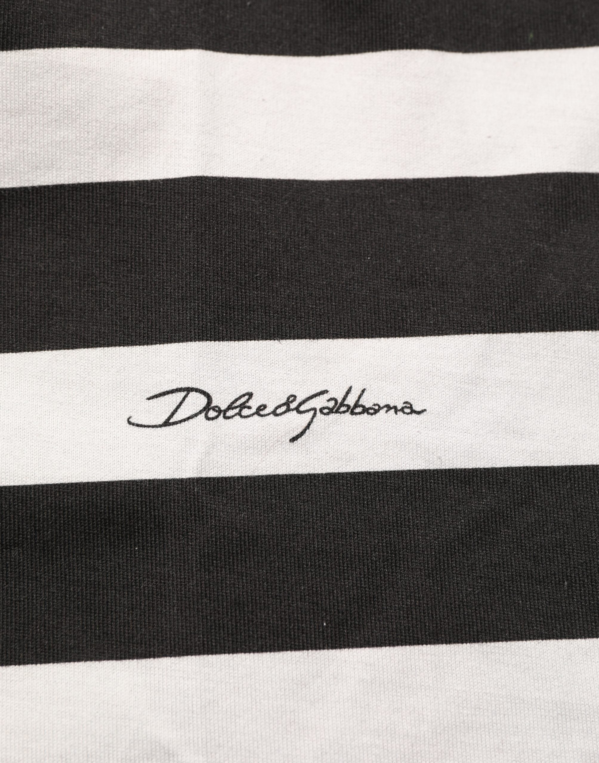 Experience the allure of Dolce & Gabbana's Black White Stripes Cotton Sleeveless T-shirt, a testament to Italian craftsmanship and timeless elegance, perfect for any sophisticated wardrobe.
