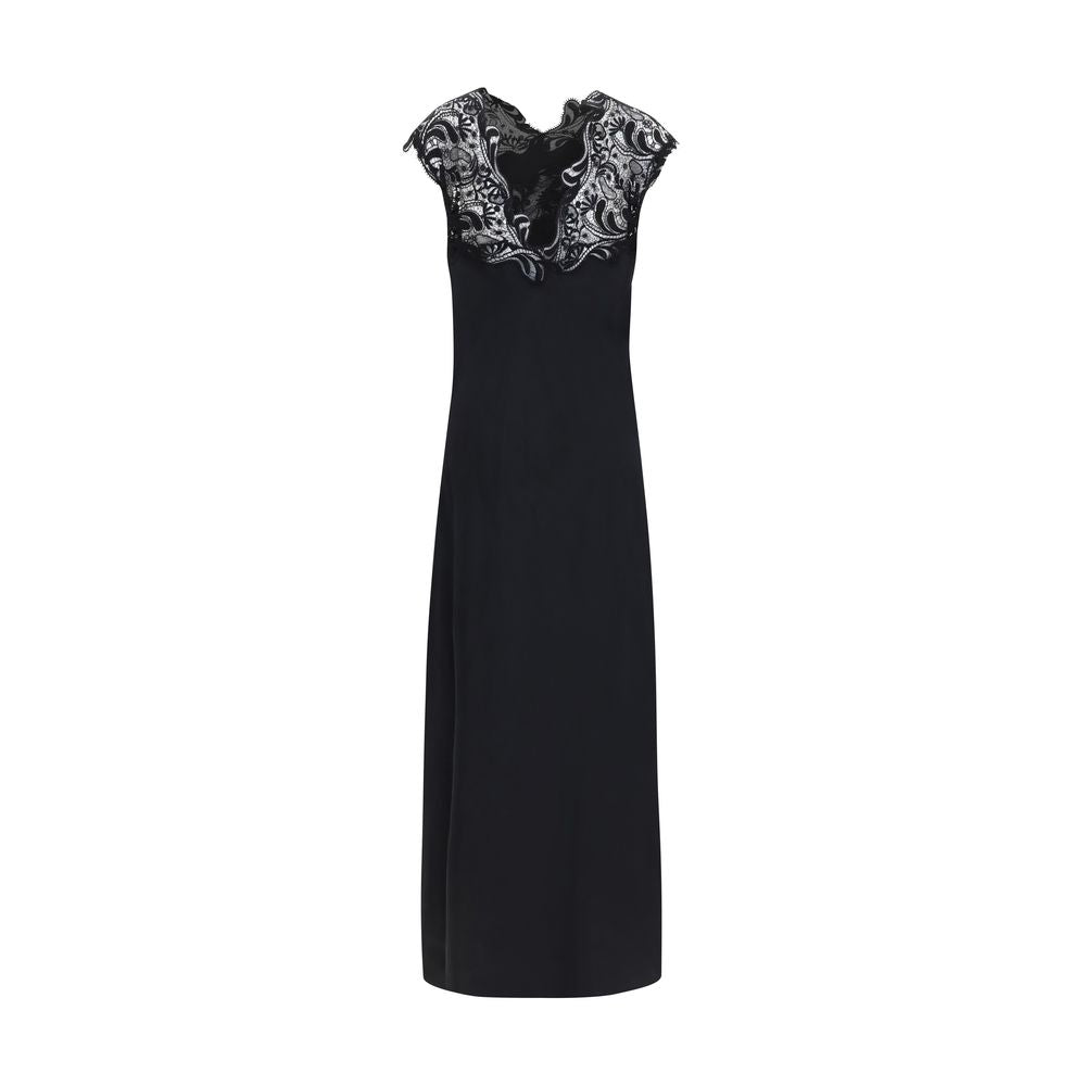Indulge in the Ferragamo Black Silk Cocktail Dress, a masterpiece of expert craftsmanship and luxurious silk, perfect for elevating your presence at any upscale event.