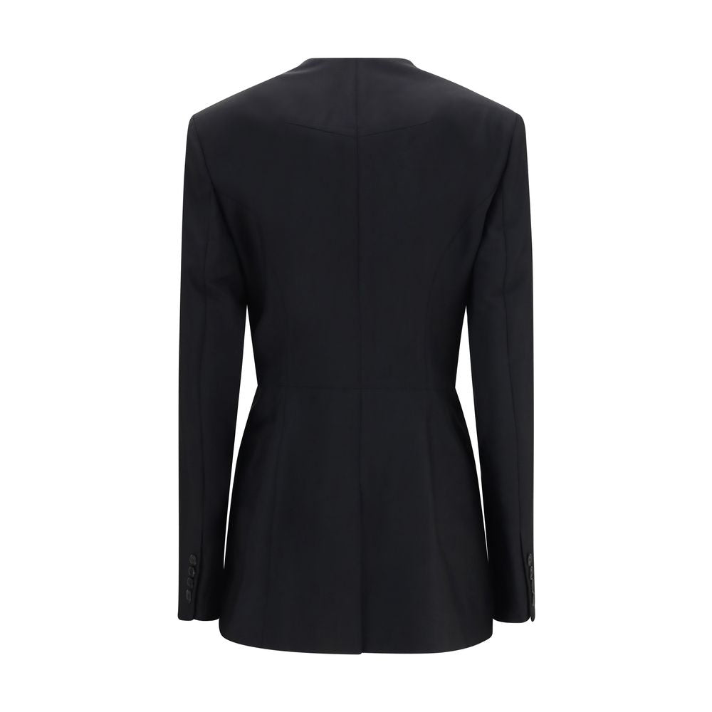 Discover the Givenchy Black Wool Oves Aries Blazer, a masterpiece of luxurious craftsmanship blending wool and mohair, perfect for those who embody elegance and sophistication.