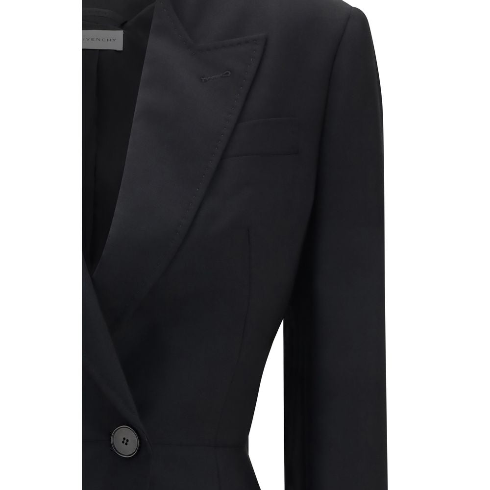 Discover the Givenchy Black Wool Oves Aries Blazer, a masterpiece of luxury crafted from a refined wool and mohair blend, embodying timeless elegance and modern sophistication.