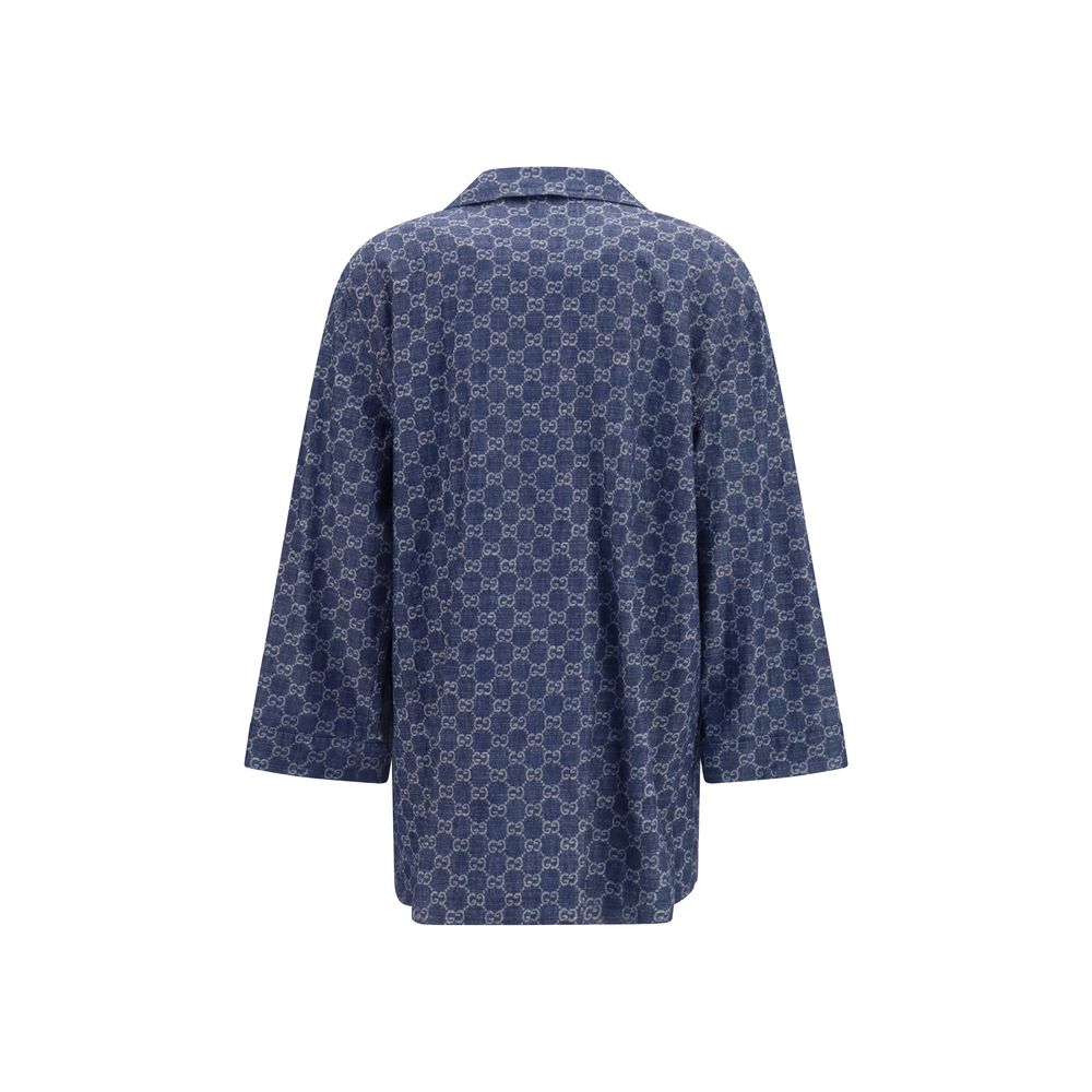 Elevate your wardrobe with the Gucci Blue Cotton Full-Length Jacket, a masterpiece of GG jacquard craftsmanship that embodies timeless elegance and modern sophistication.
