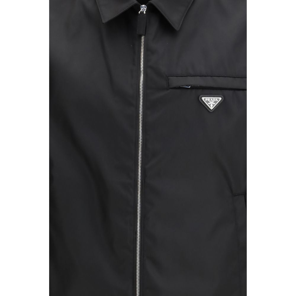 Elevate your style with the Prada Black Recycled Polyamide Full-Length Jacket, a fusion of sustainable luxury and modern design that embodies timeless elegance.