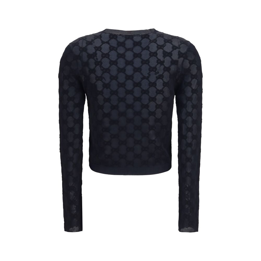 Discover the Gucci Black Viscose Cardigan, a timeless piece of fine viscose crepe and bouclé cotton, embodying elegance and sophistication for the discerning wardrobe.