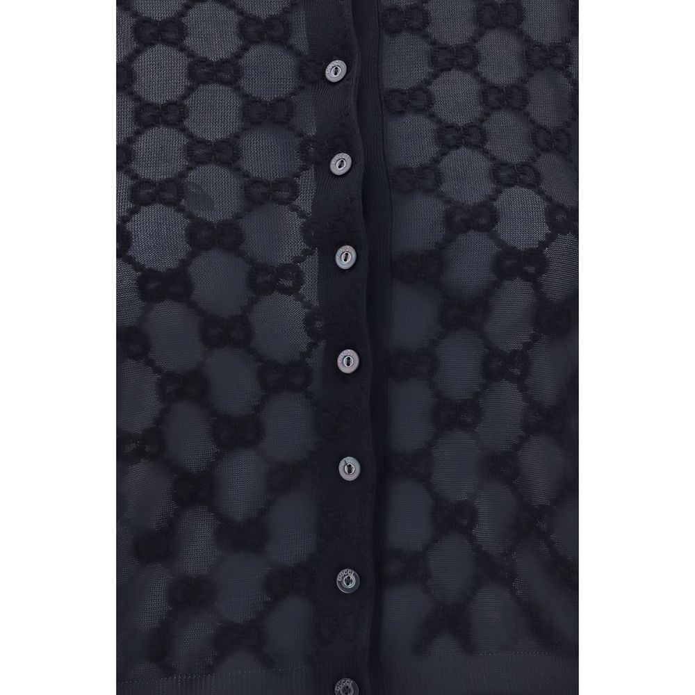 Experience the allure of the Gucci Black Viscose Cardigan, crafted from fine viscose crepe and bouclé cotton, embodying timeless elegance for the discerning individual.