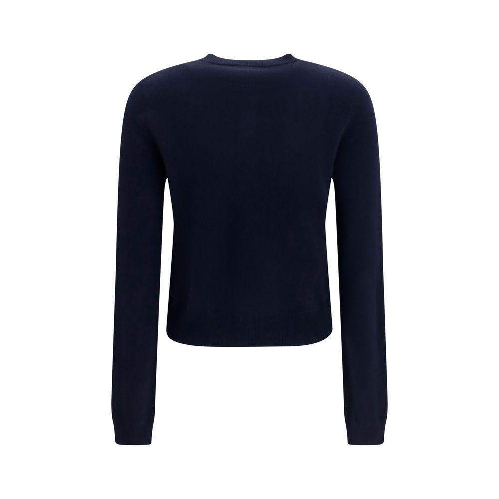 Indulge in the timeless elegance of the Lisa Yang Blue Cashmere Cardigan, crafted from 100% Kashmir for a luxurious feel that elevates any wardrobe.