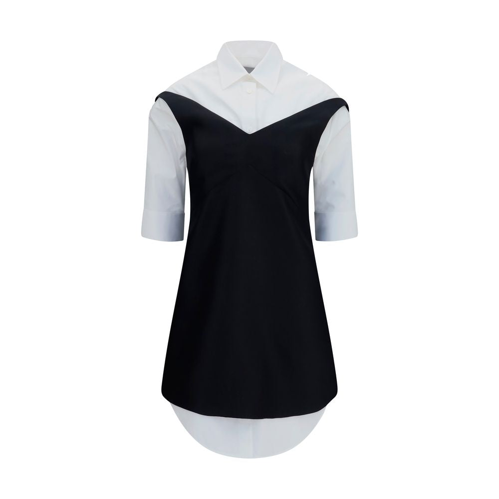 Discover the Balenciaga Black Wool Oves Aries Casual Dress, a luxurious blend of Merino Wool and silk, embodying timeless elegance and innovative design for the discerning individual.