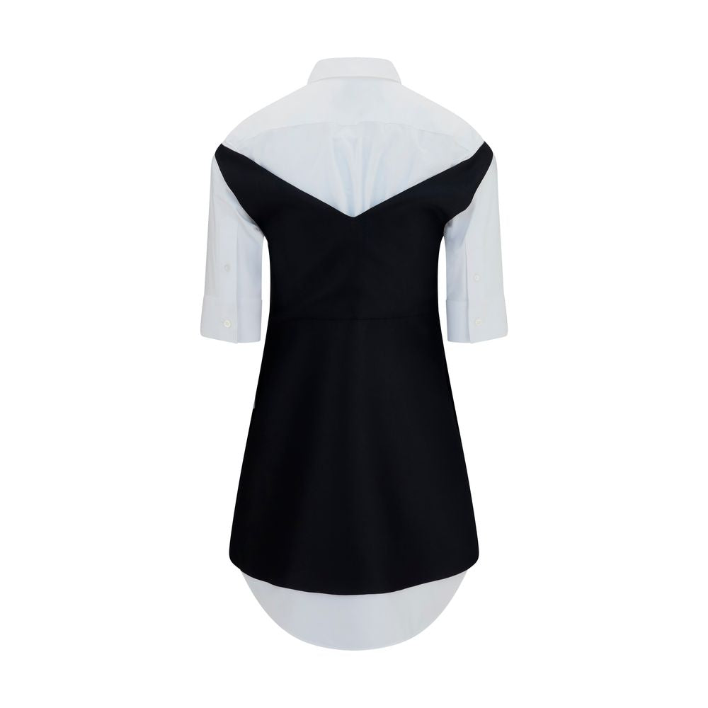 Discover the Balenciaga Black Wool Oves Aries Casual Dress, a masterpiece of Merino Wool and silk, embodying timeless elegance and innovative design for the discerning individual.