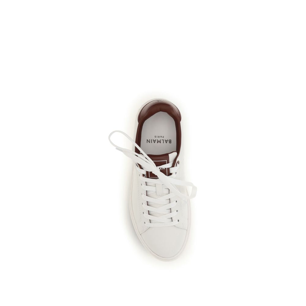 Experience the exquisite craftsmanship of Balmain White Calf Leather Bos Taurus Athletic Sneakers, where luxury meets sport in a timeless design that elevates every step.