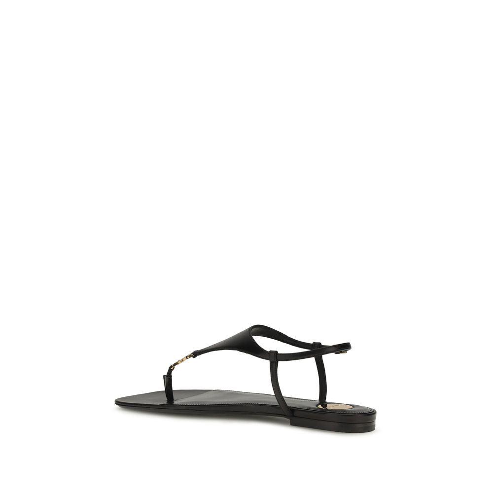 Discover the Saint Laurent Black Calf Leather Bos Taurus Flat Sandals, where exquisite craftsmanship meets timeless elegance, perfect for the discerning connoisseur.