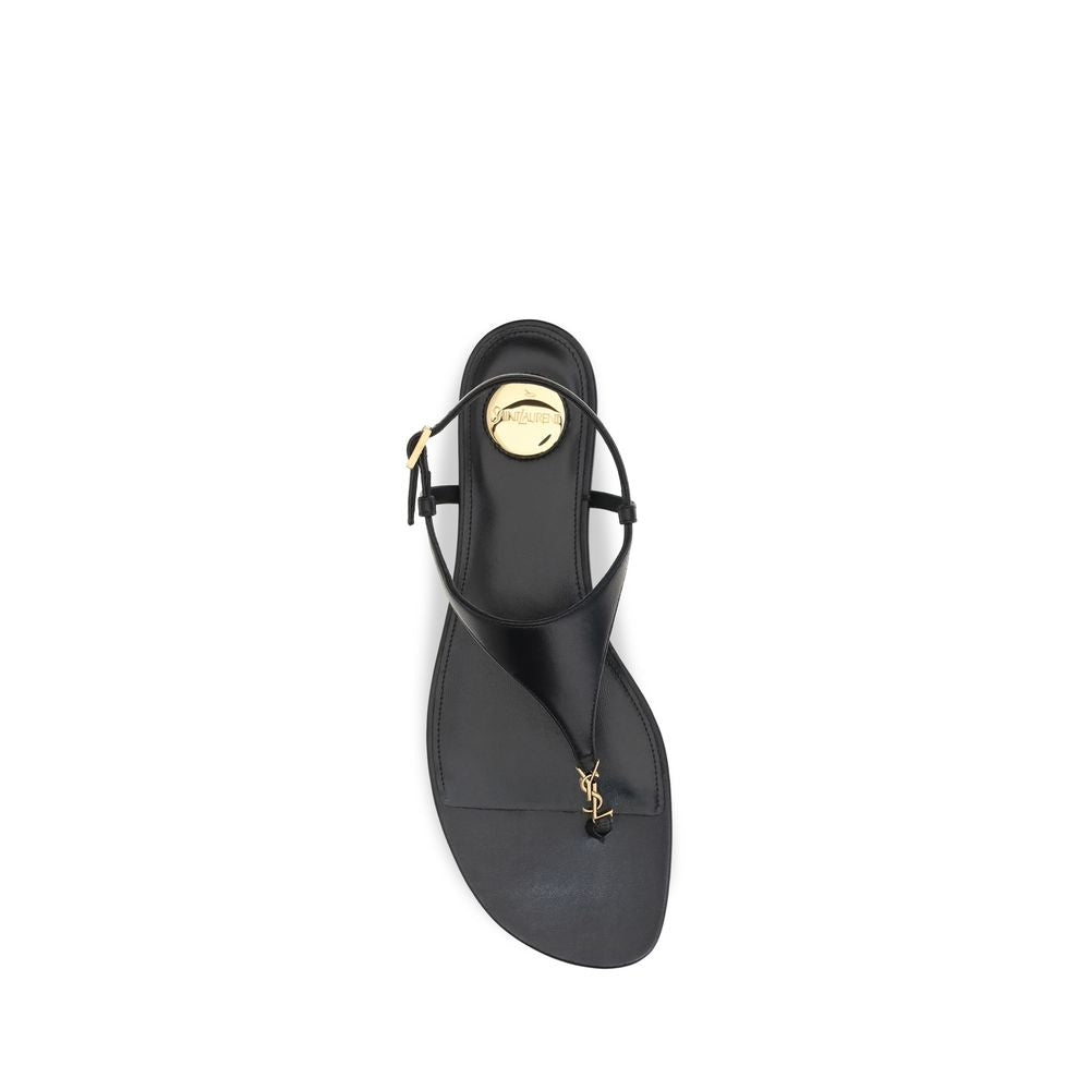 Elevate your style with Saint Laurent's Black Calf Leather Bos Taurus Flat Sandals, where exquisite craftsmanship meets timeless elegance for the discerning connoisseur.