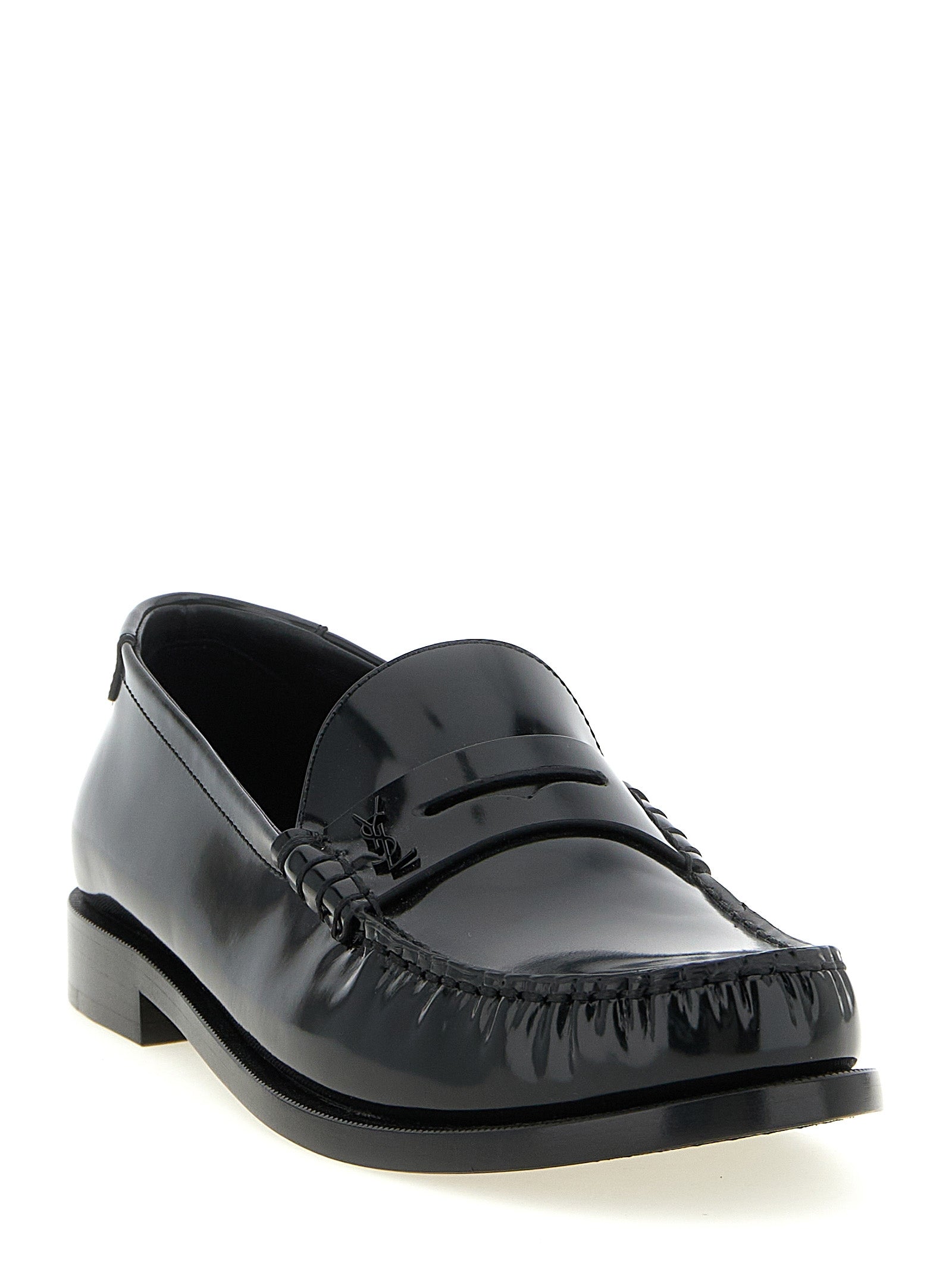Experience the allure of Saint Laurent's Black Calfskin Slip-On Loafers, where exquisite craftsmanship meets timeless elegance, perfect for the discerning modern connoisseur.