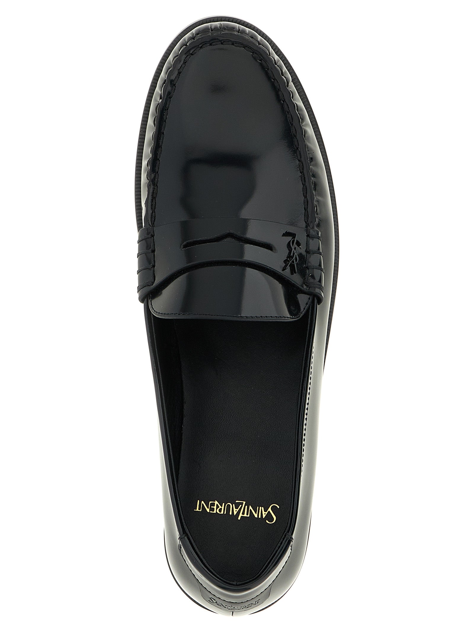 Step into a realm of sophistication with Saint Laurent's Black Calfskin Slip-On Loafers, where luxurious craftsmanship meets timeless elegance, perfect for the discerning connoisseur.