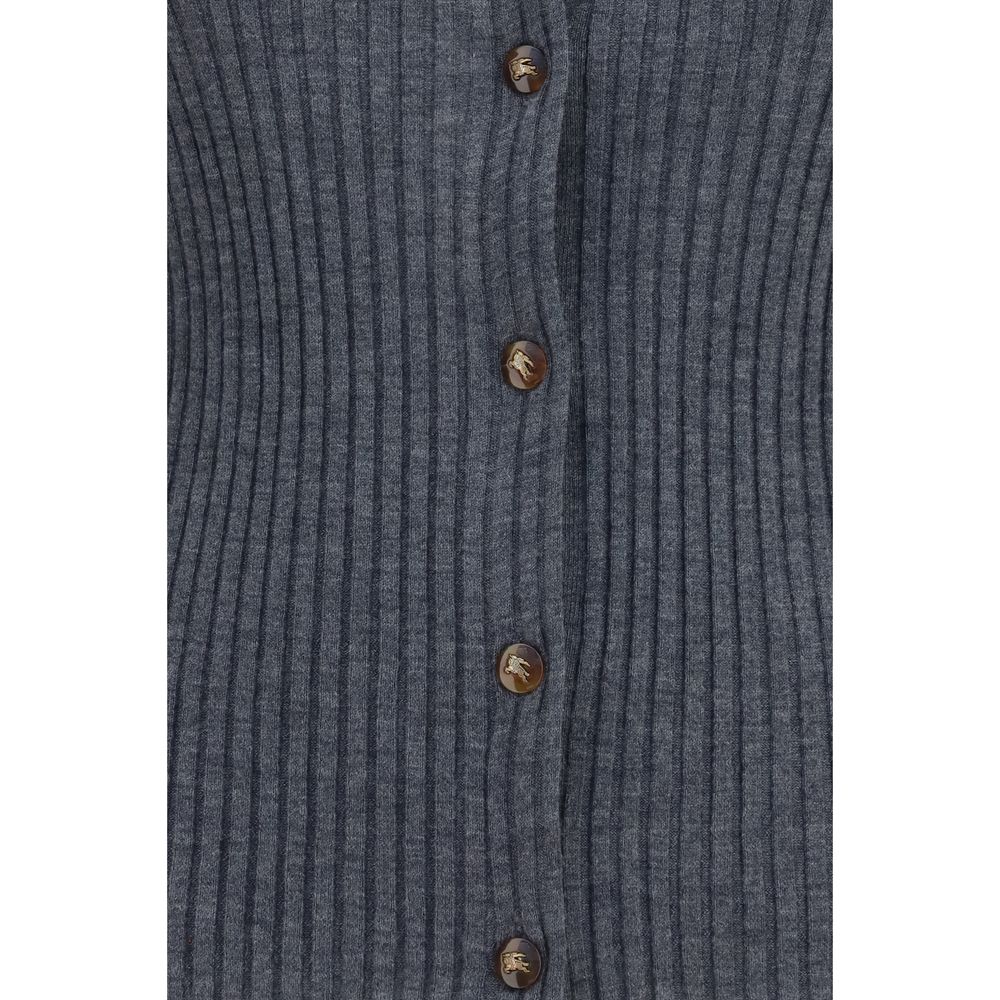 Indulge in the Burberry Gray Cashmere Cardigan, a masterpiece of 100% cashmere, embodying timeless elegance and sophisticated allure for the discerning wardrobe.