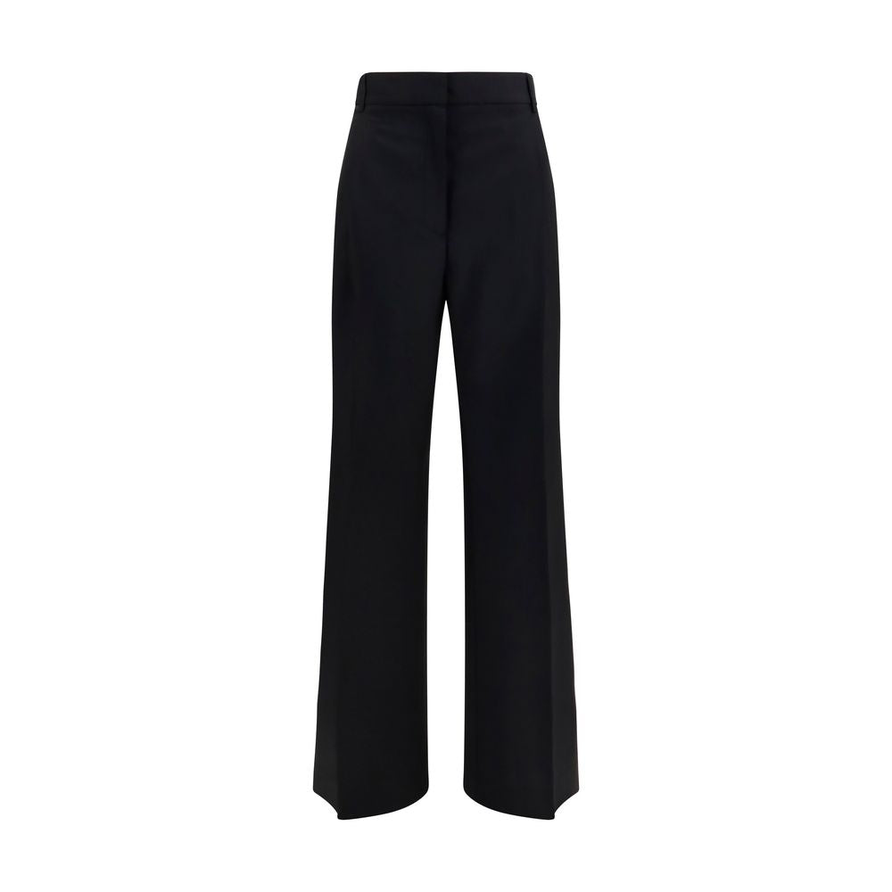 Discover the Rohe Black Wool Oves Aries Dress Pants, a masterpiece of fleece wool and mohair, embodying modern elegance and sophistication for the discerning individual.