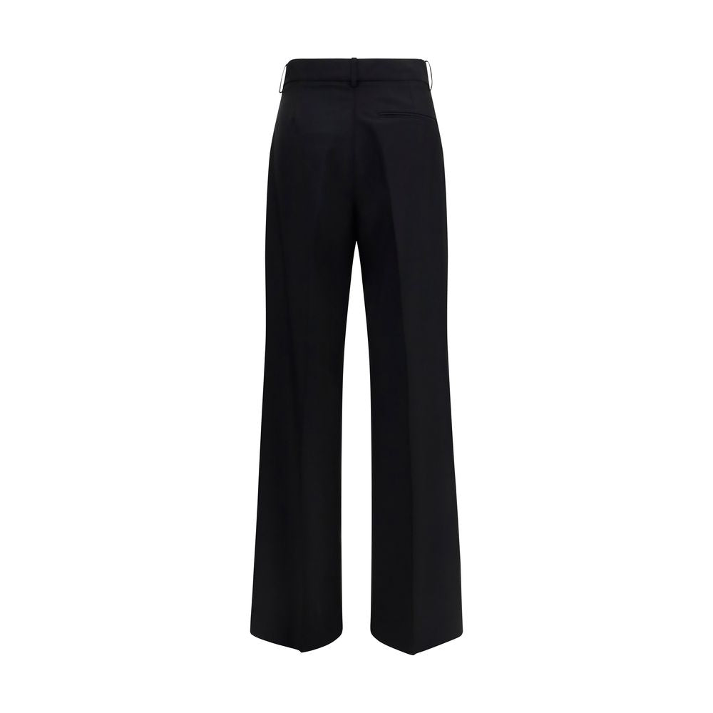 Experience the allure of Róhe's Black Wool Oves Aries Dress Pants, crafted from luxurious fleece wool and mohair, embodying modern elegance for the discerning individual.