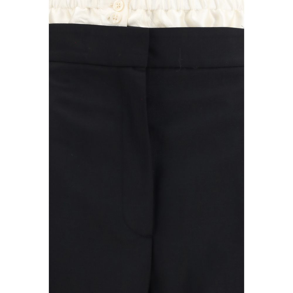 Discover the Rohe Black Wool Oves Aries Dress Pants, a blend of fleece wool and mohair, epitomizing modern elegance and sophistication for the discerning fashionista.