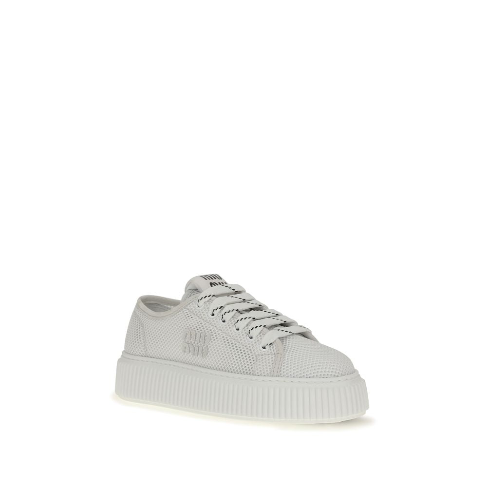 Elevate your style with Miu Miu White Polyamide Platform Sneakers, a luxurious blend of sporty elegance and contemporary femininity, crafted for the discerning modern individual.