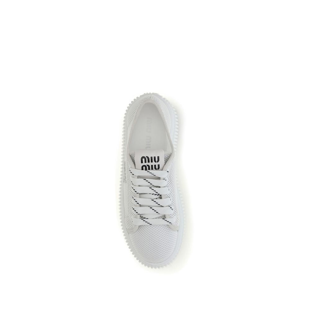 Elevate your style with Miu Miu White Polyamide Platform Sneakers, a luxurious blend of sporty elegance and modern femininity, crafted for the discerning individual.