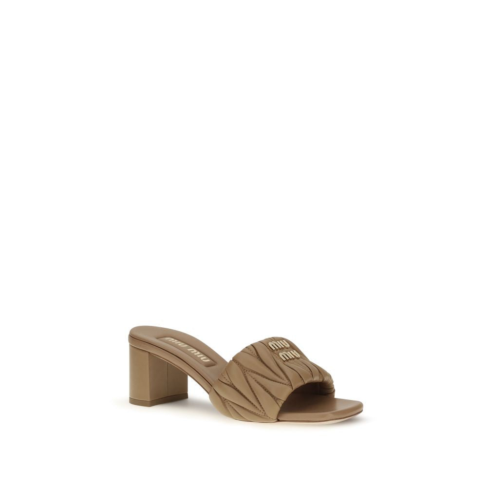Indulge in the exquisite Miu Miu Beige Lamb Ovis Aries Aries Platform Sandals, where sumptuous lambskin meets timeless elegance, elevating every sophisticated ensemble.