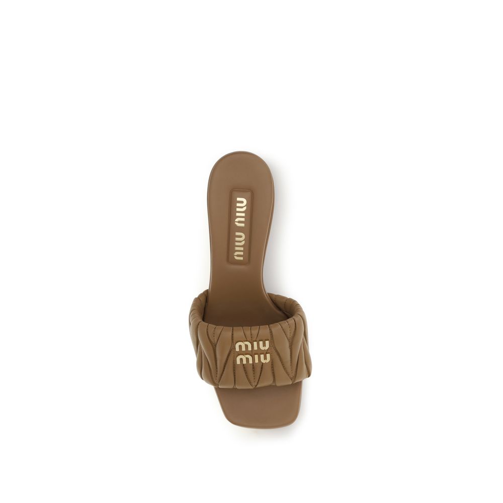Discover the Miu Miu Beige Lamb Ovis Aries Aries Platform Sandals, a luxurious blend of lambskin and calf leather, designed for those who embody elegance and confidence.