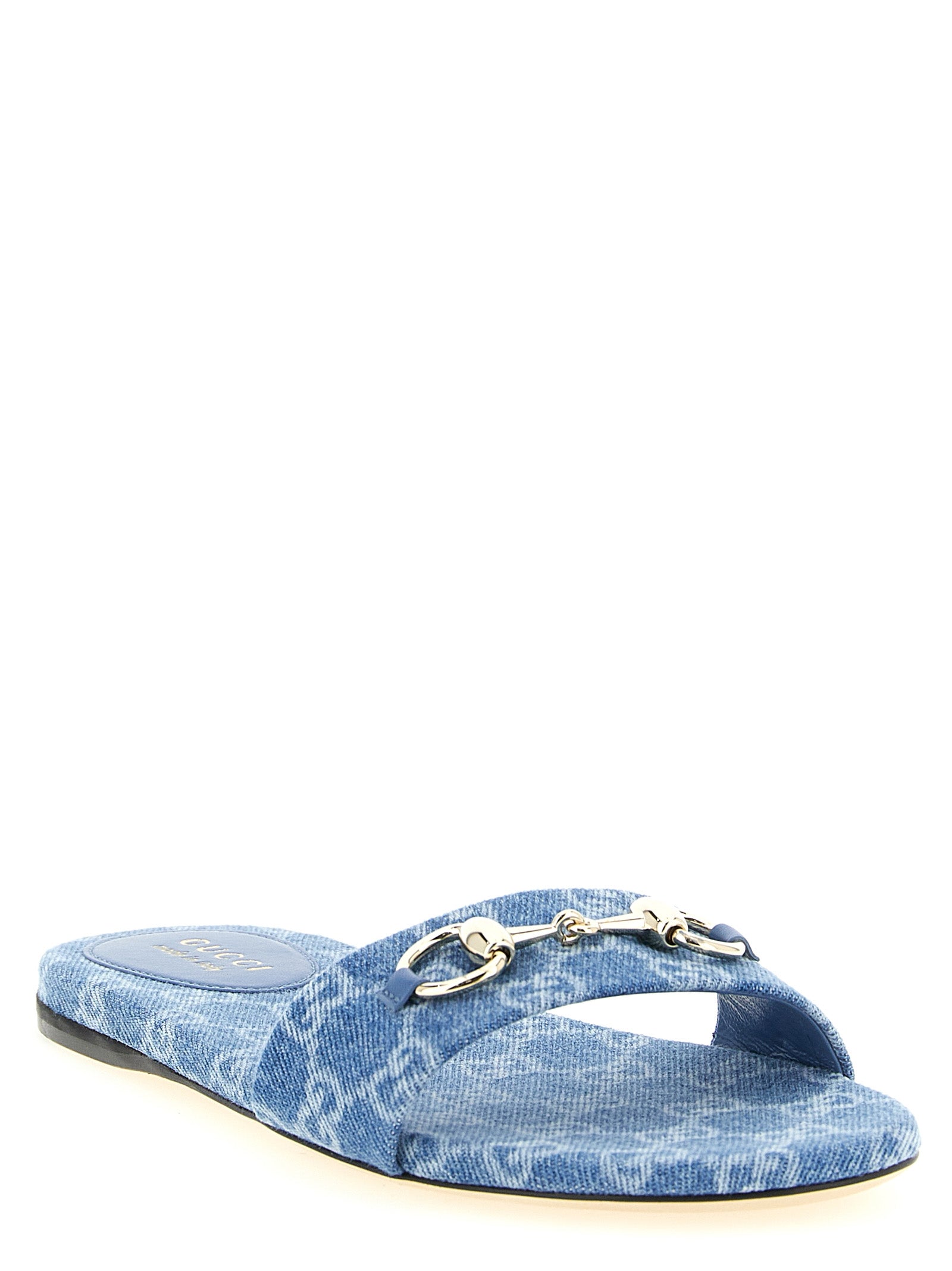 Elevate your summer style with Gucci Blue Cotton Slides, crafted from luxurious cotton in a serene light blue, embodying sophistication and comfort for discerning tastes.