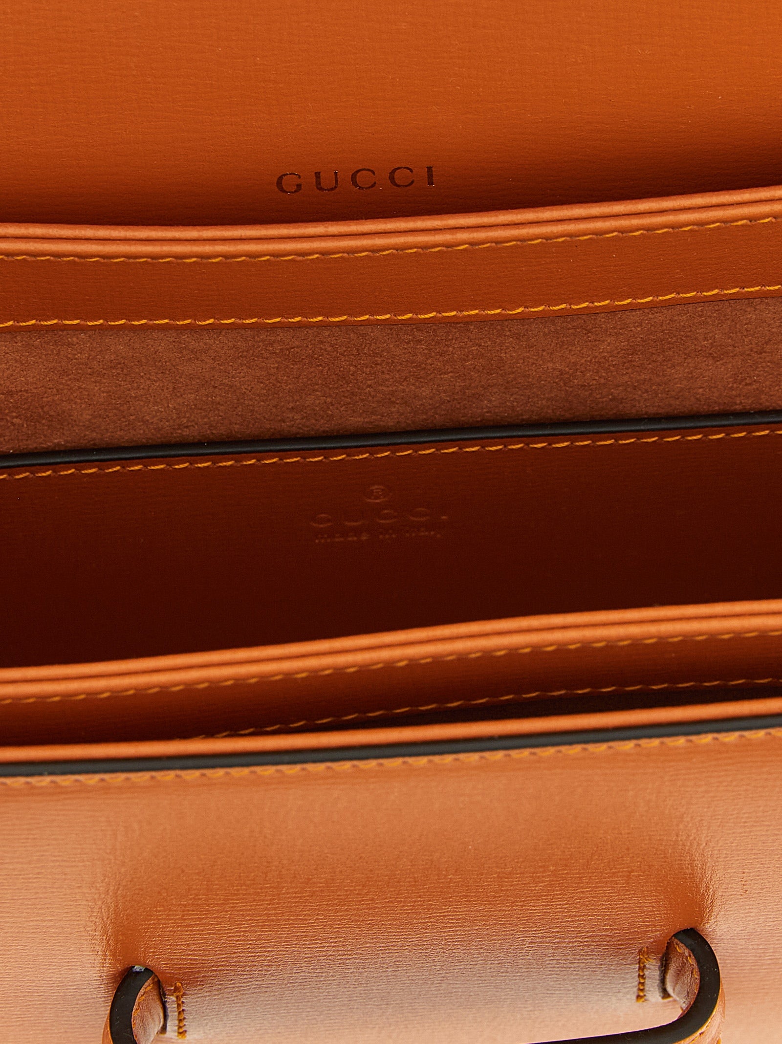 Indulge in the allure of the Gucci Orange Calfskin Shoulder Bag, a masterpiece of Italian craftsmanship, embodying luxury and sophistication for the discerning individual.