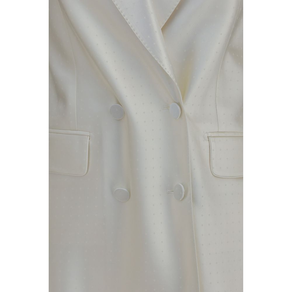 Elevate your style with the Tom Ford Beige Viscose Blazer, a masterpiece of luxurious silk and viscose, embodying refined elegance and timeless sophistication for every occasion.