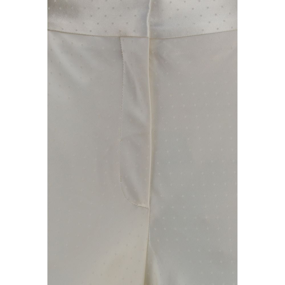 Experience the allure of Tom Ford's Beige Viscose Dress Pants, a luxurious blend of silk and viscose, embodying timeless elegance and exquisite craftsmanship for every occasion.